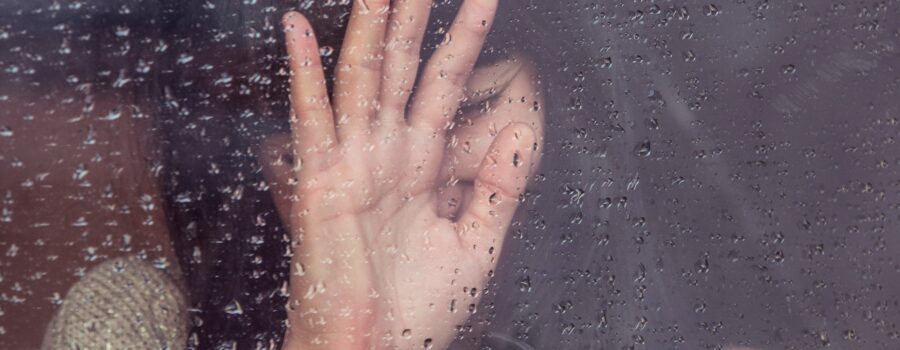 Person in contemplative moment of pain or grief